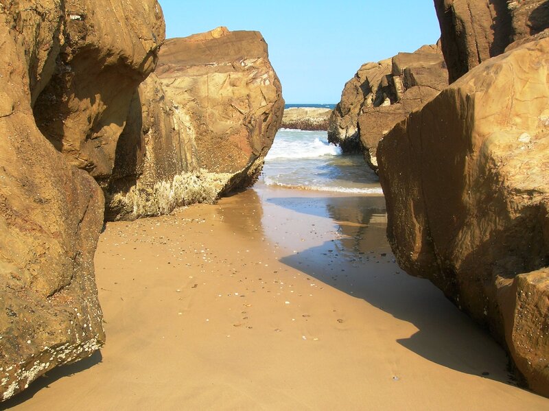 Sand Beach Between Rocks