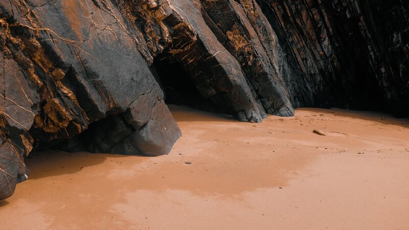 Sand Beach with Rock Formations