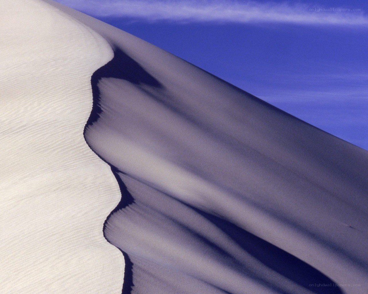 Sand dune with blue sky