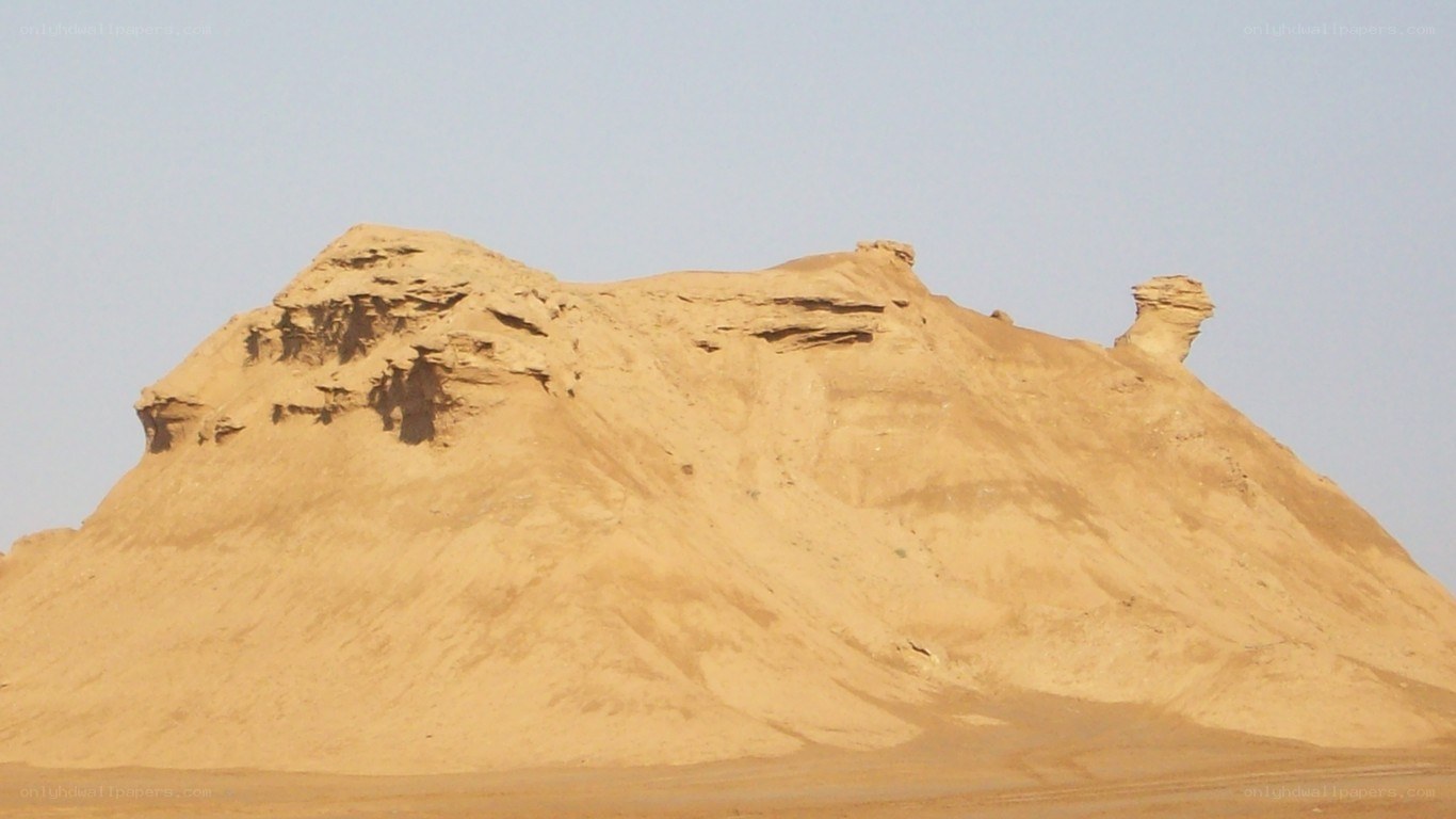 sand dune with rock formation