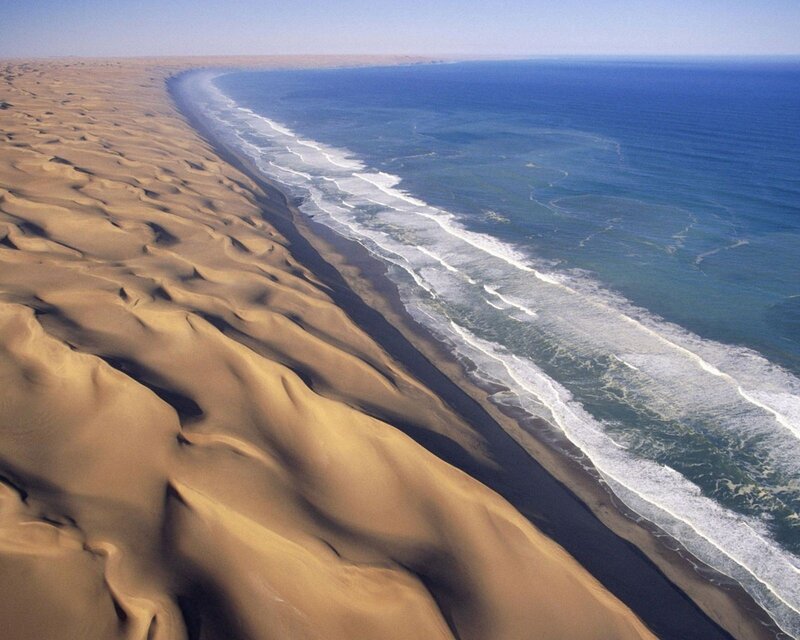 Sand Dunes Meeting Ocean — Brown, Serene