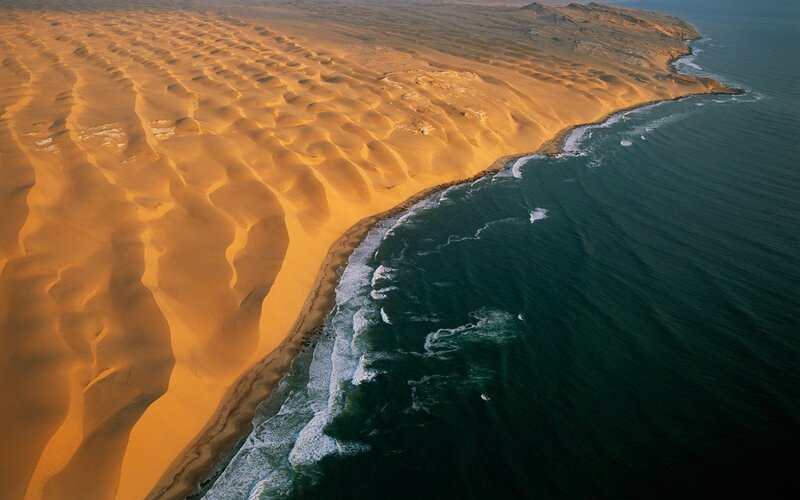 Sand Dunes Meeting Ocean — Orange