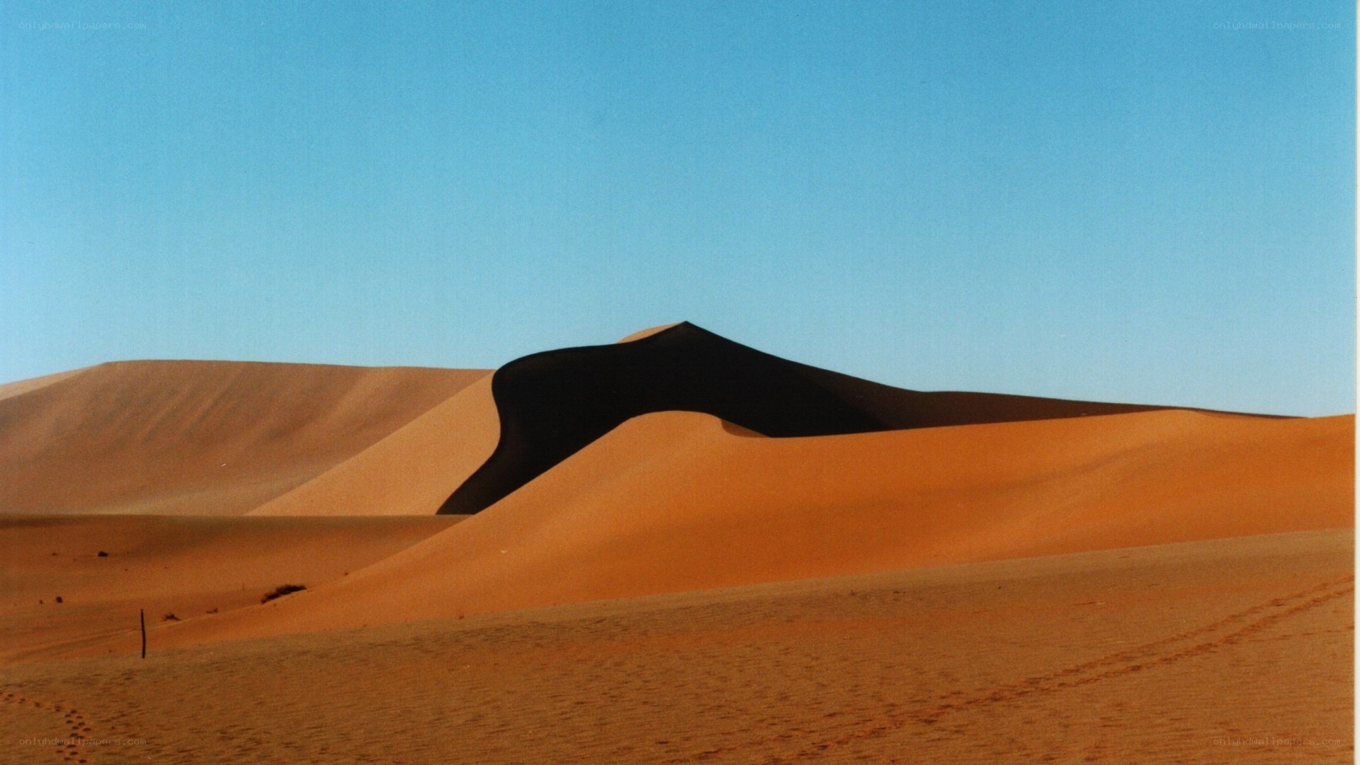 sand dunes under blue sky