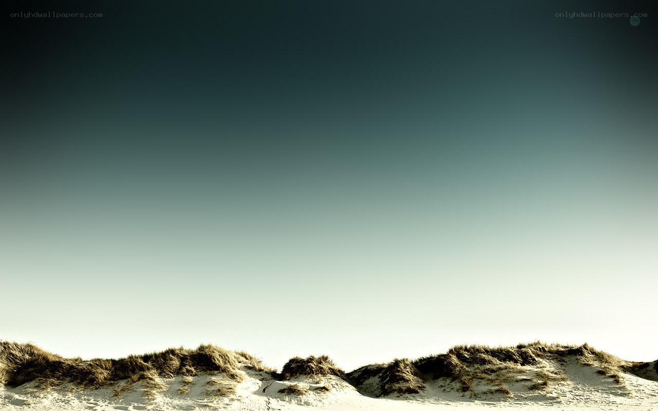 sand dunes under clear sky