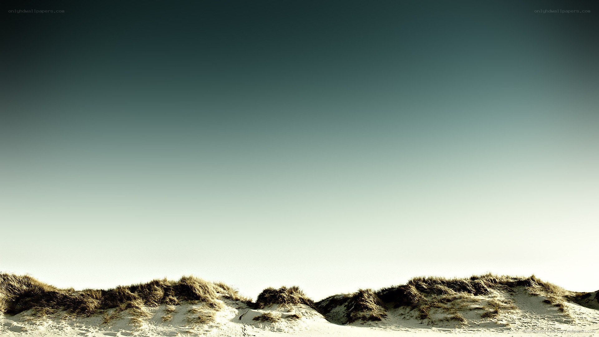 sand dunes under clear sky
