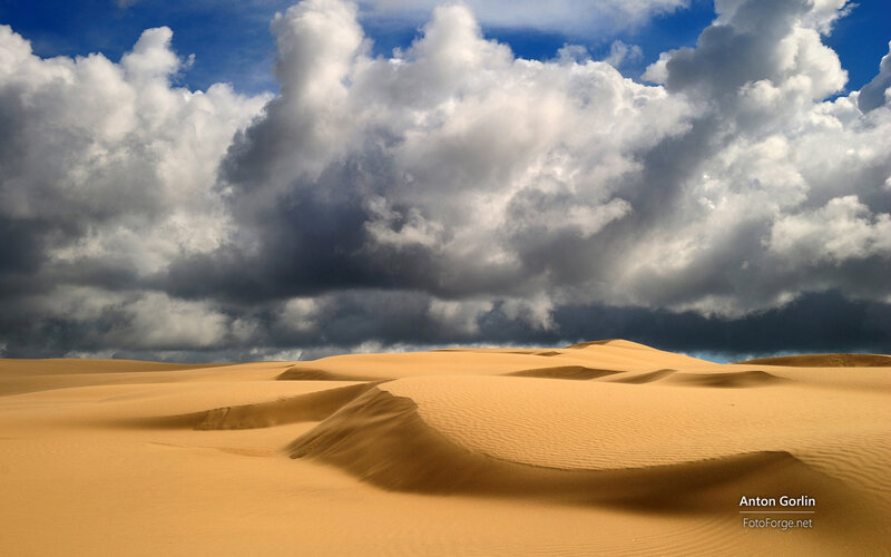 Sand Dunes under Storm Clouds