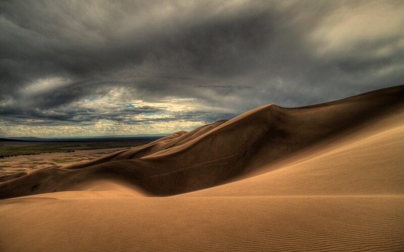 Sand Dunes under Stormy Sky — Brown