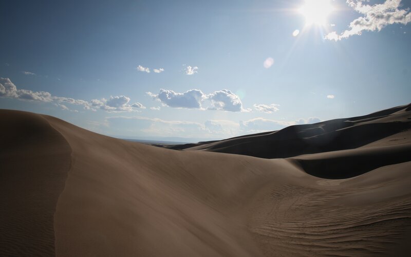 Sand Dunes under Sun — Brown