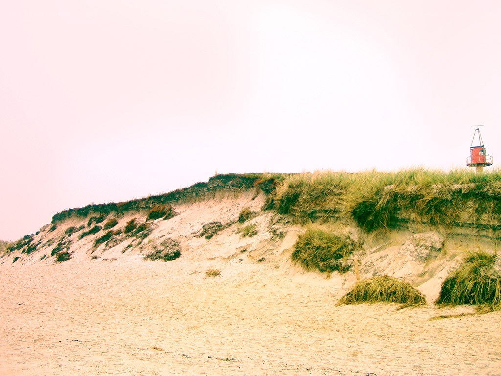 sand dunes with lifeguard tower