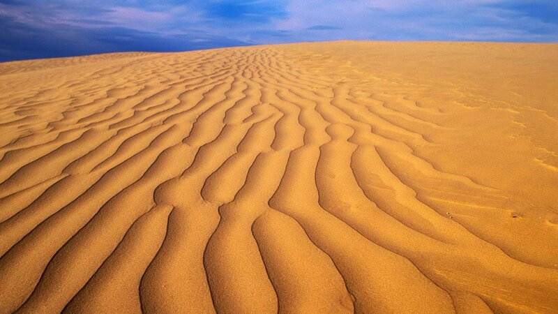 Sand dunes with rippled patterns
