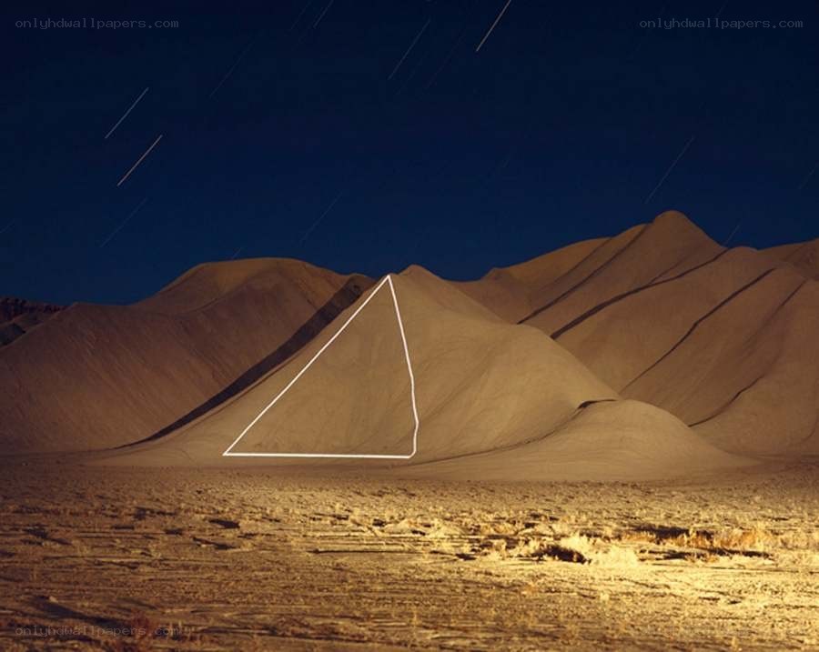 sand dunes with star trails