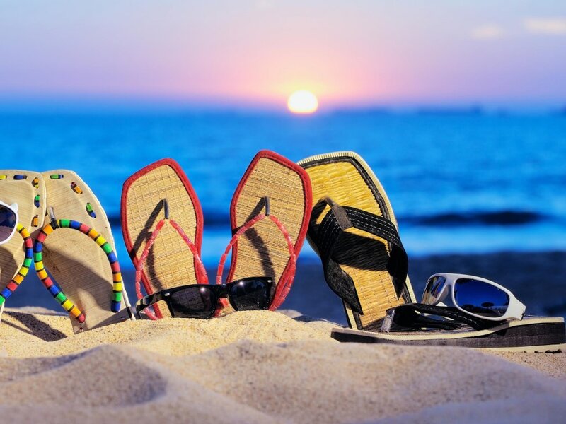 Sandals and Sunglasses on Beach