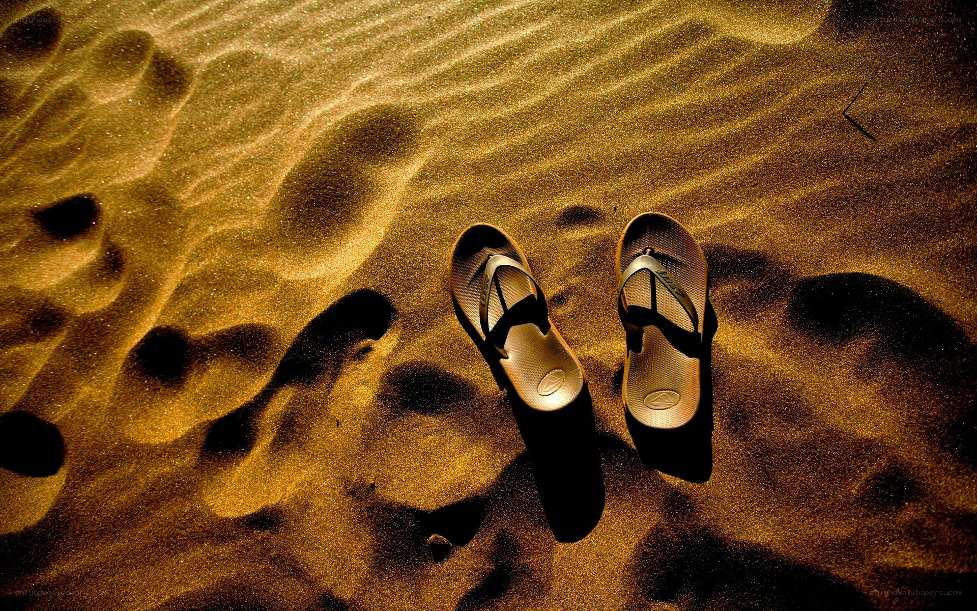 Sandals on a sandy beach