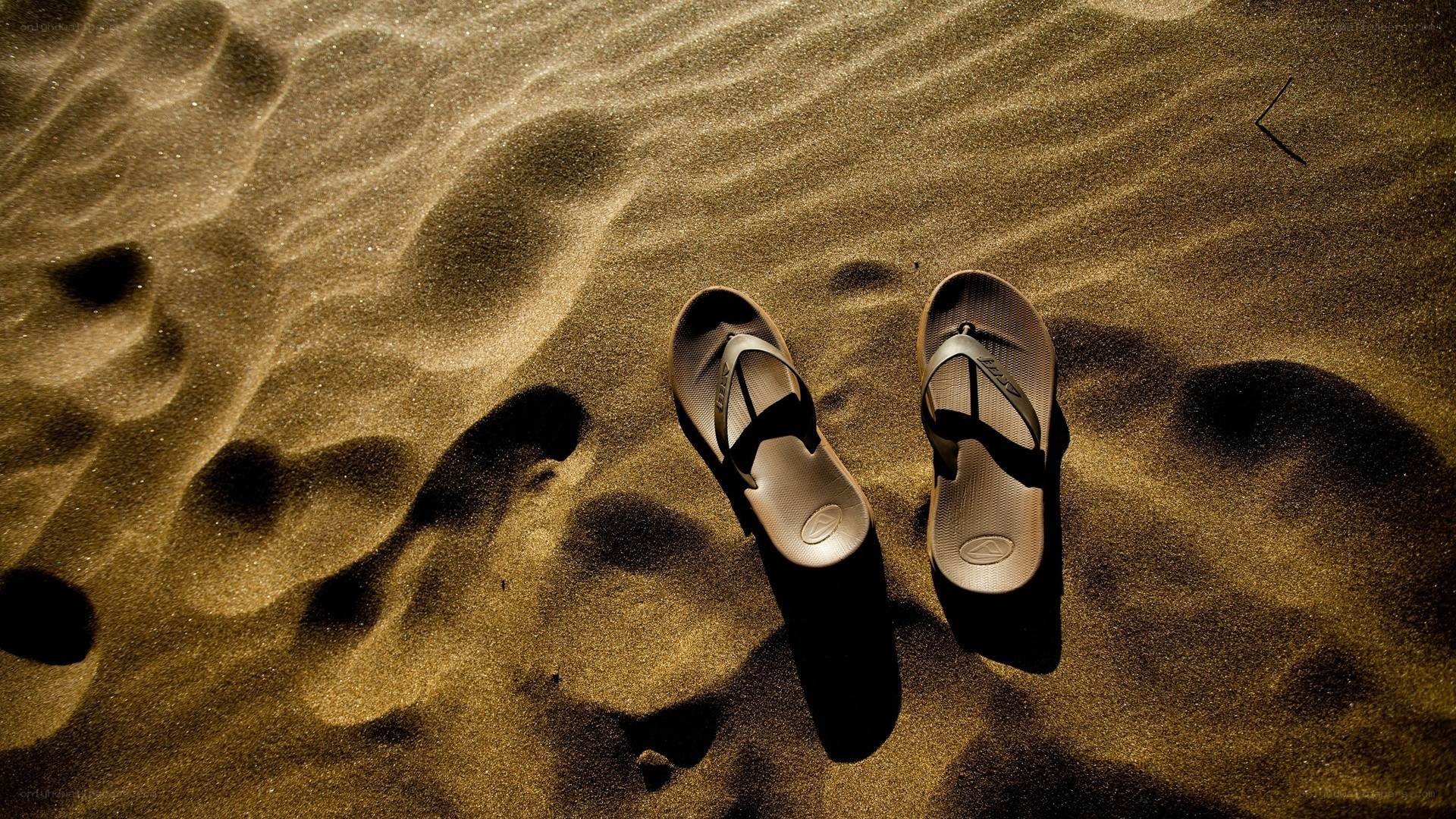 Sandals on a sandy beach