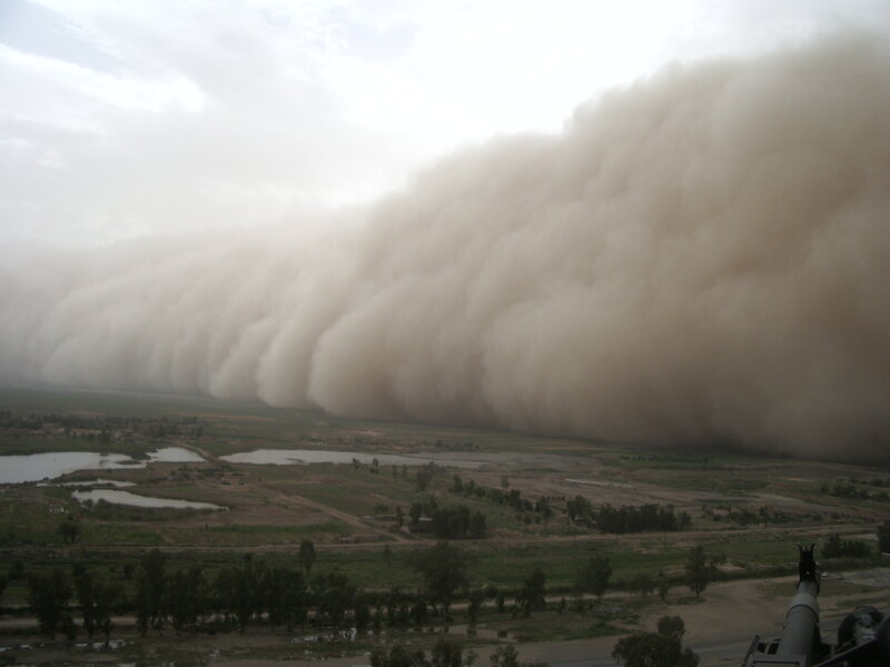 Sandstorm approaching landscape