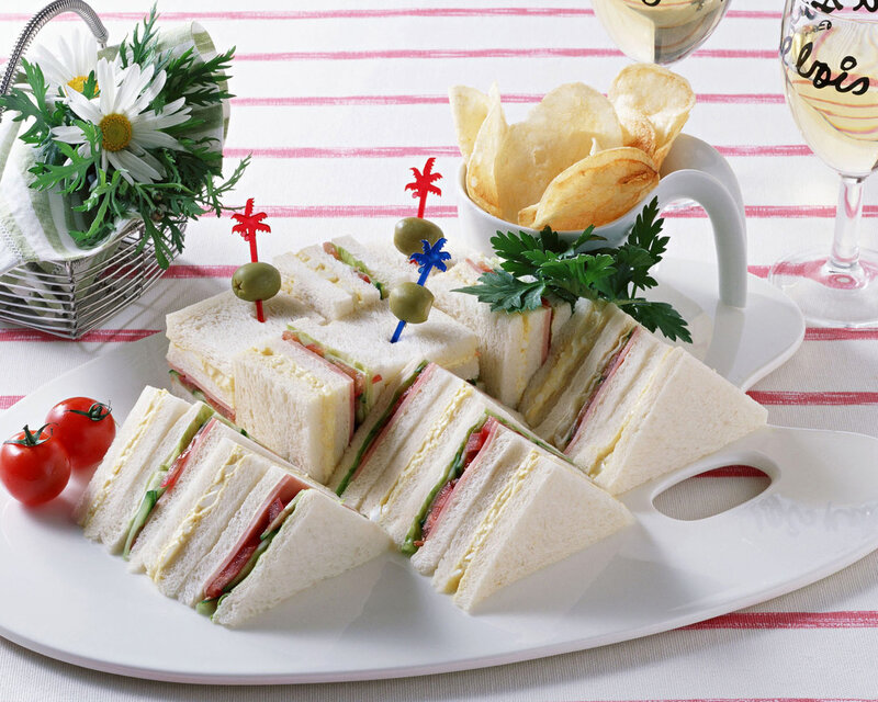 Sandwiches with chips and wine