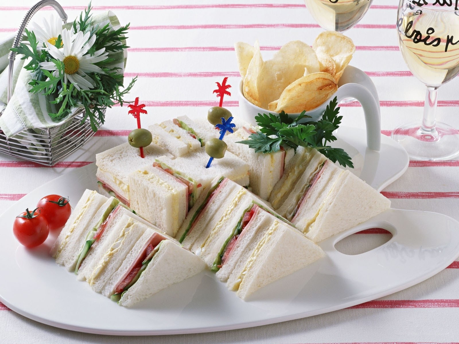 Sandwiches with chips and wine