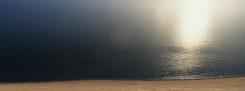 Sandy Beach and Ocean — Blue, Serene, Sunset