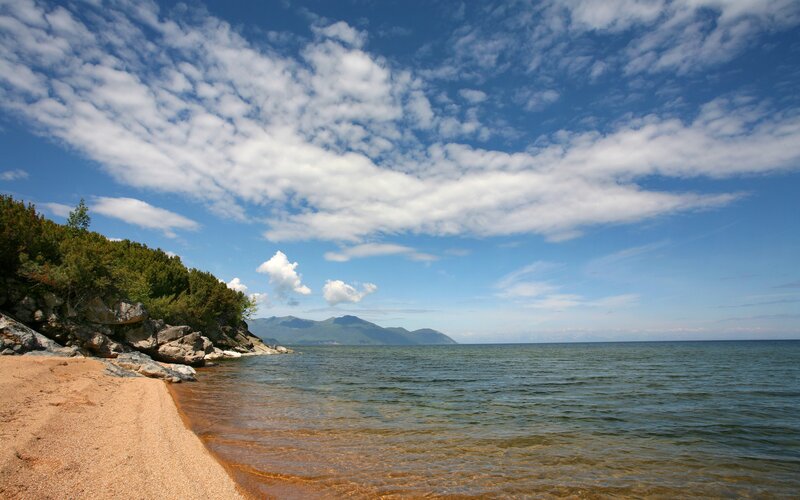 Sandy beach by a large lake