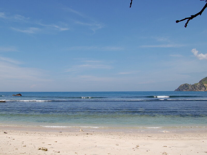 sandy beach with calm ocean