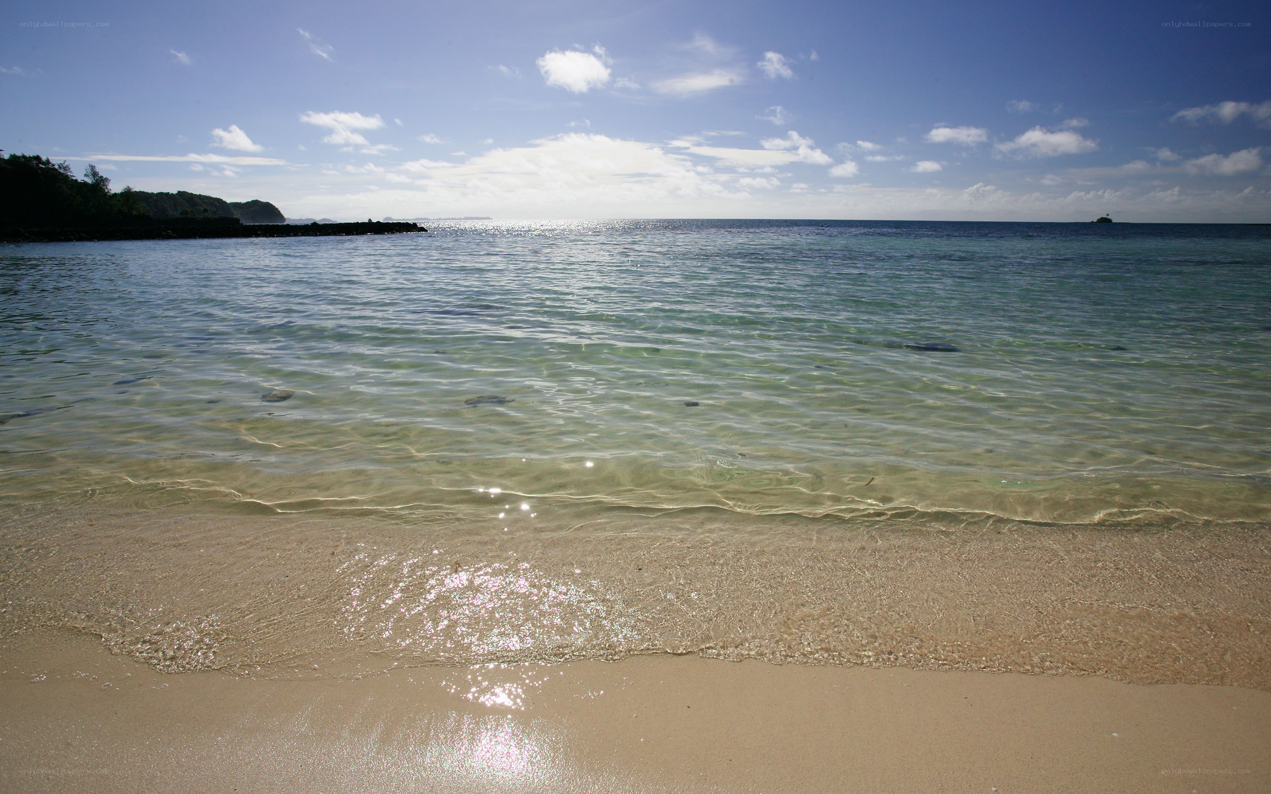 Sandy beach with clear water