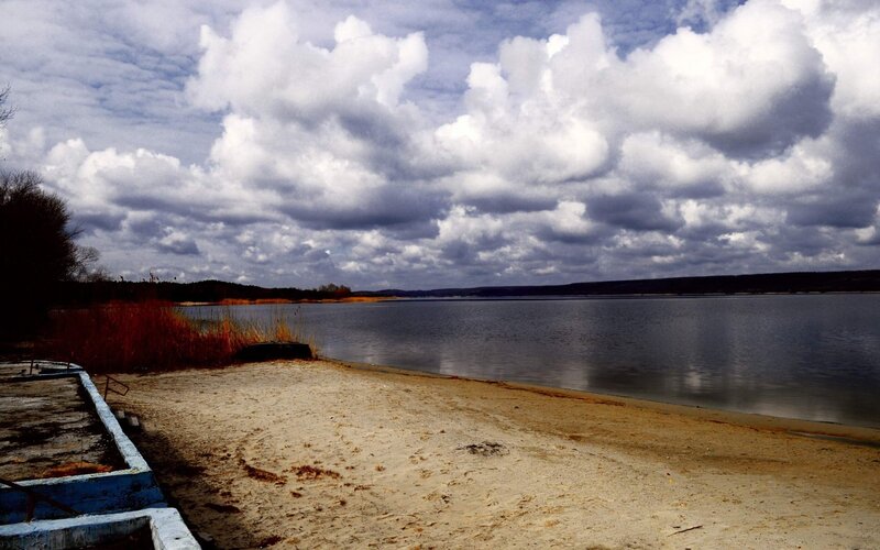 Sandy beach with cloudy sky