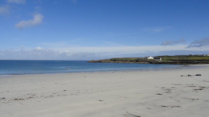 sandy beach with coastal houses