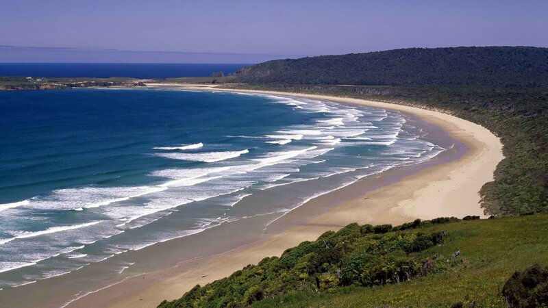 sandy beach with ocean waves