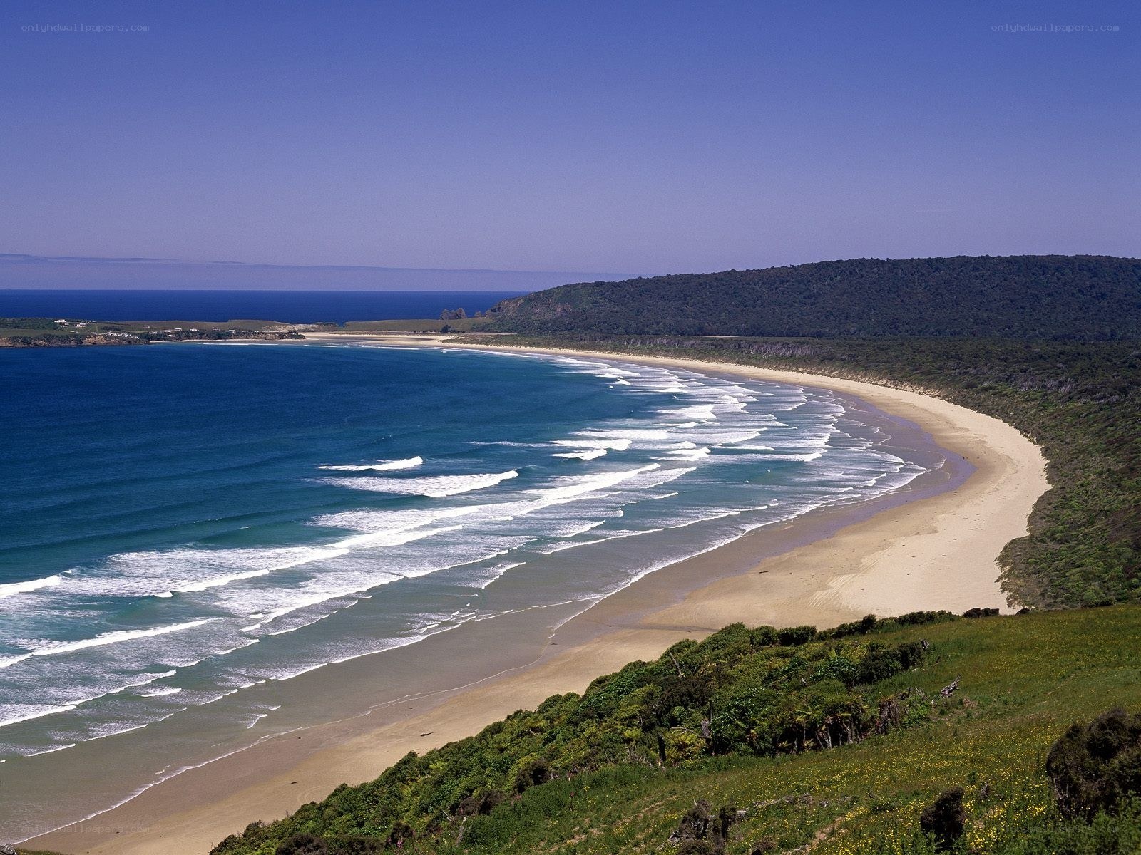 sandy beach with ocean waves