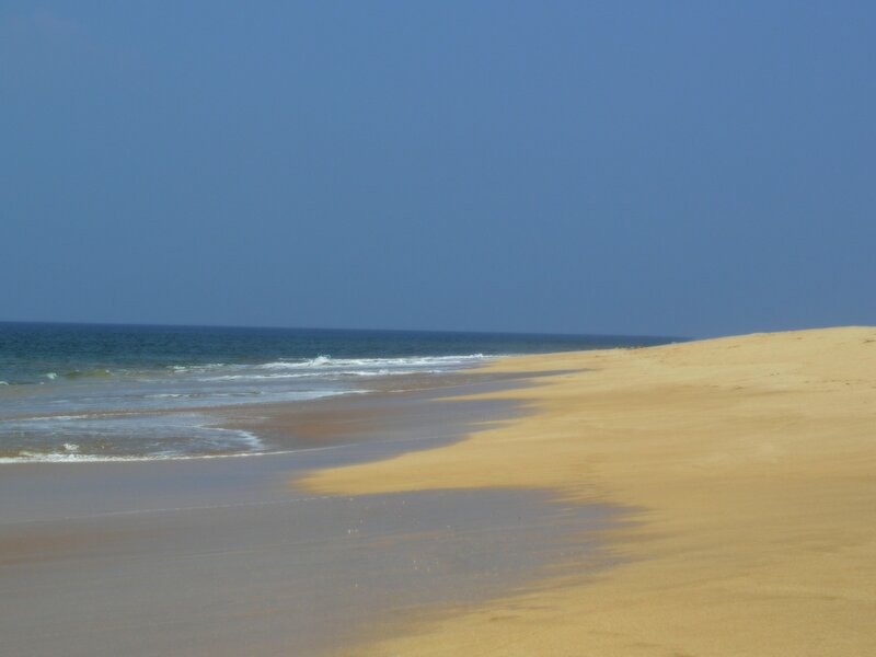 sandy beach with ocean waves