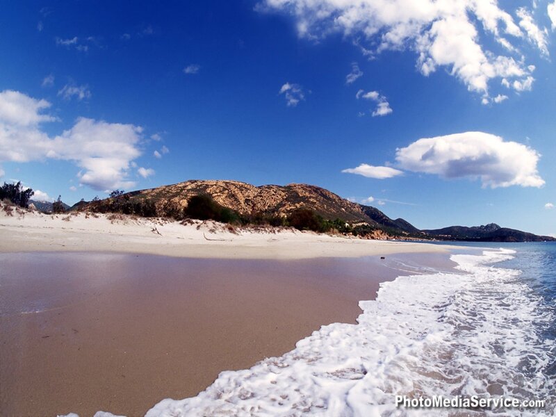 sandy beach with ocean waves