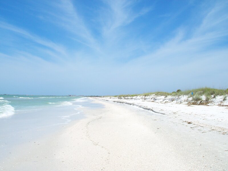 sandy beach with ocean waves