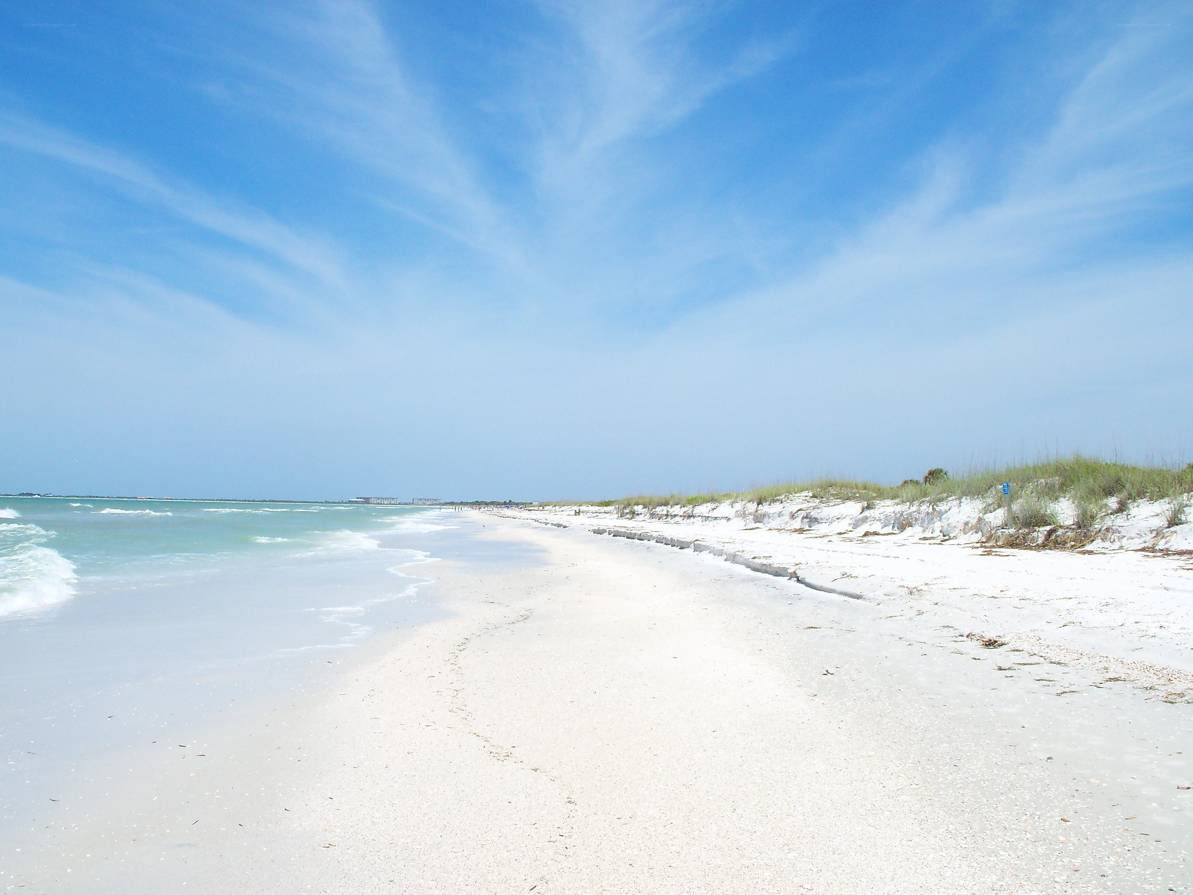 sandy beach with ocean waves