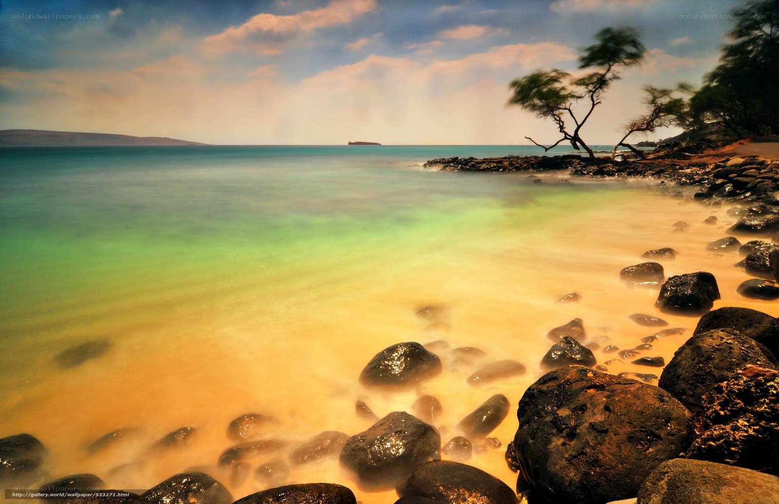 Sandy beach with rocks and ocean