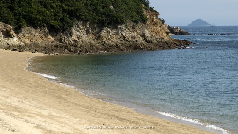 sandy beach with rocky cliffs