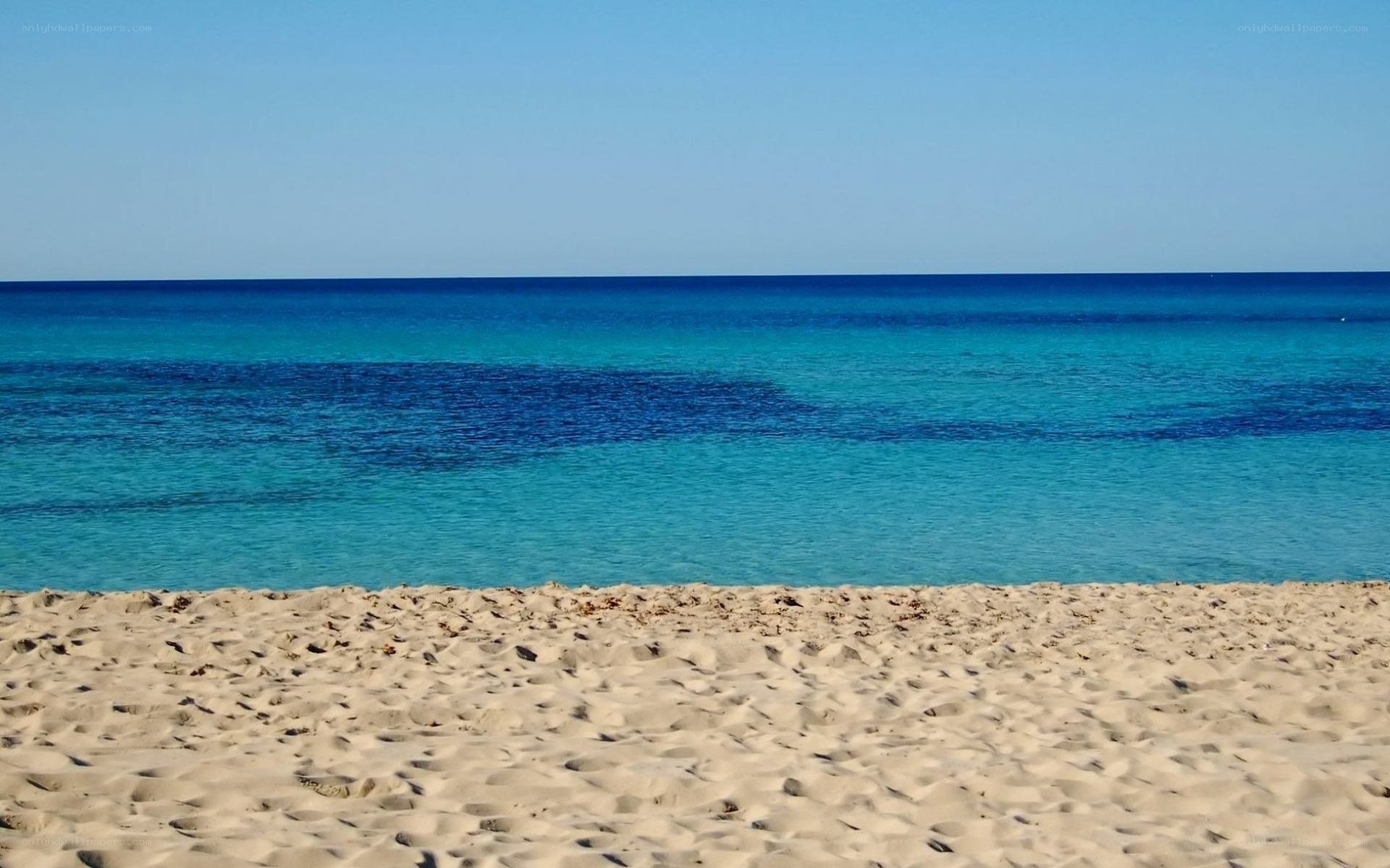 sandy beach with turquoise water