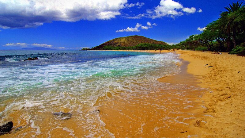 sandy beach with turquoise waves