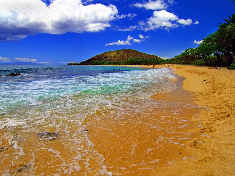 sandy beach with turquoise waves