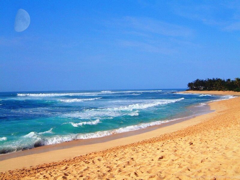 sandy beach with turquoise waves