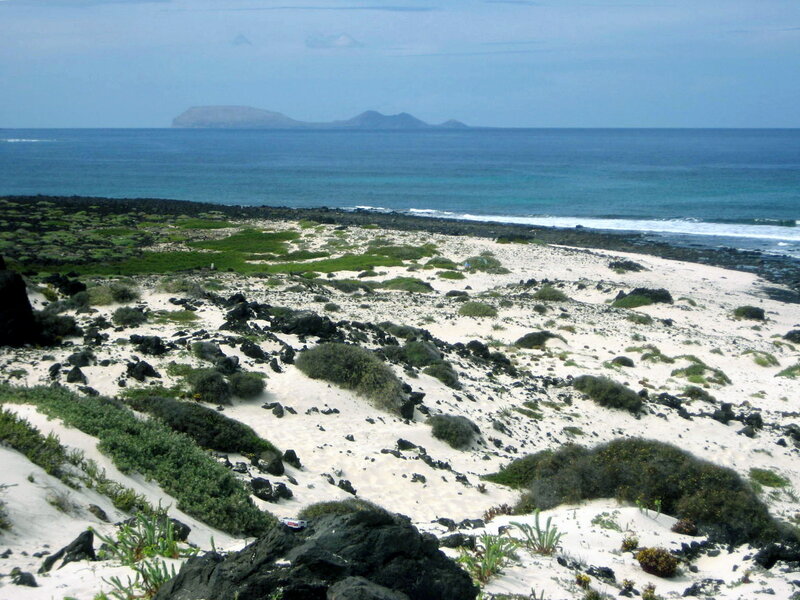 Sandy Beach with Volcanic Rocks
