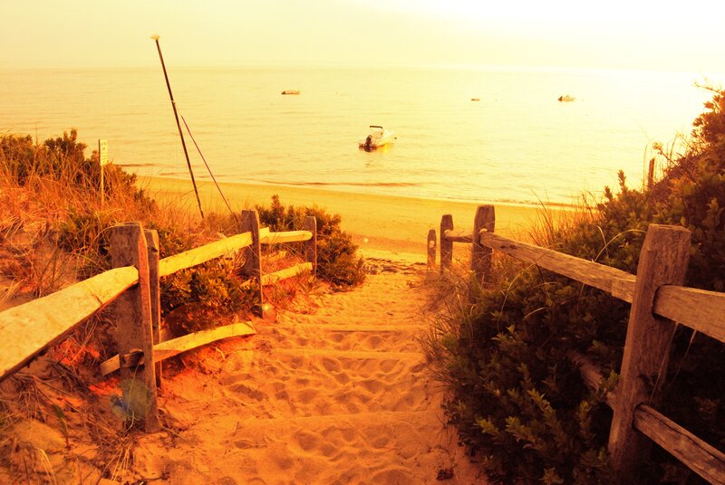 Sandy path to the beach at sunset
