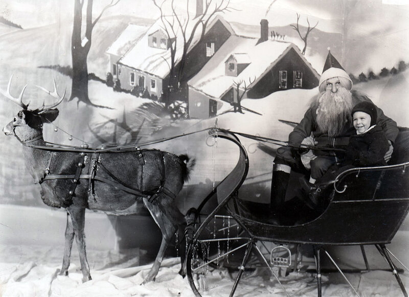 Santa and child in sleigh