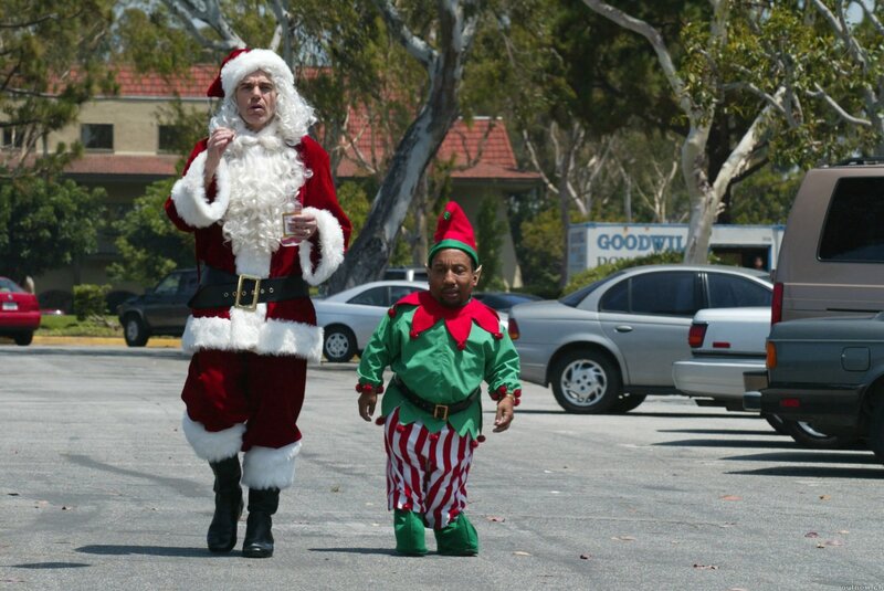 Santa and elf walking in parking lot