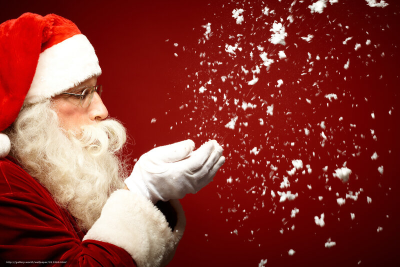 Santa blowing snowflakes
