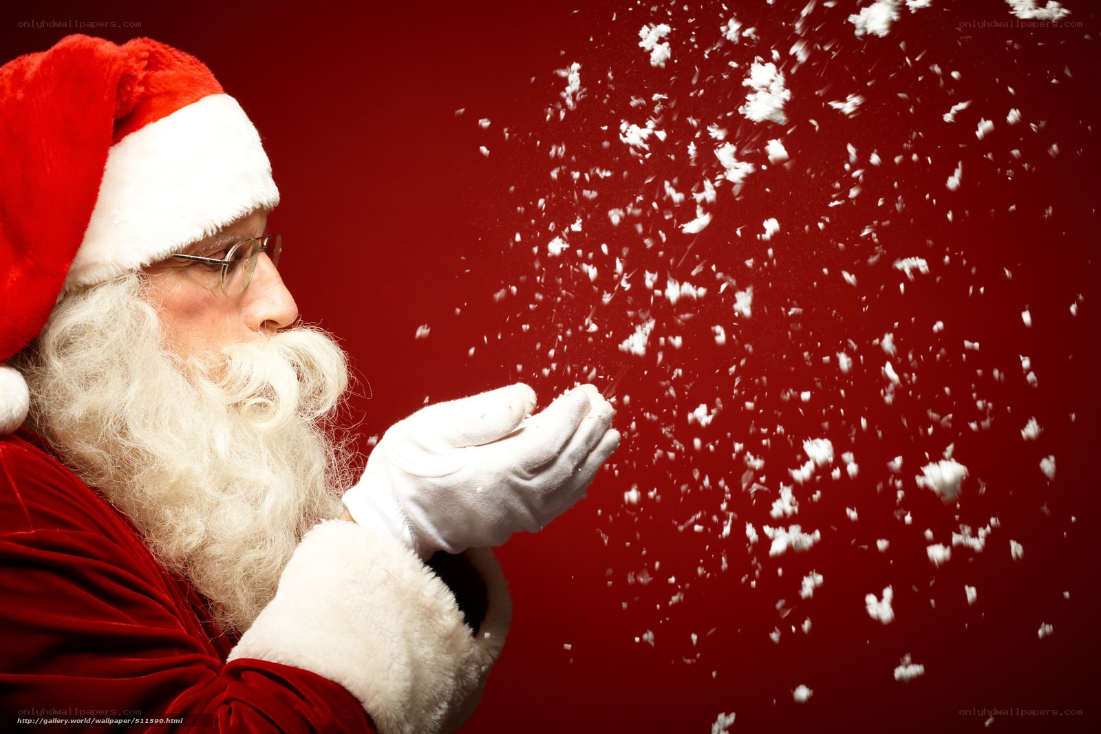Santa blowing snowflakes