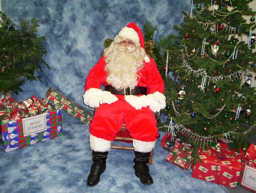 Santa Claus at Christmas tree