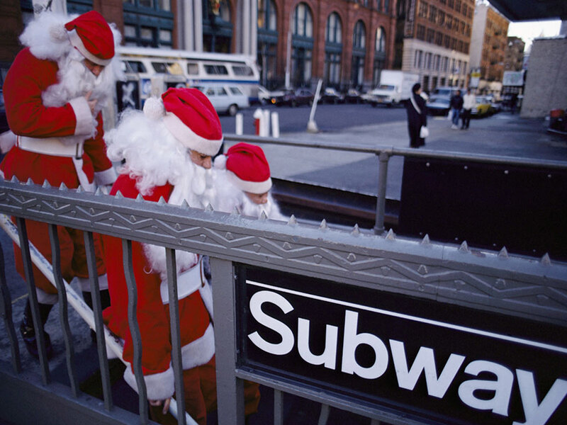 Santa Claus at subway entrance