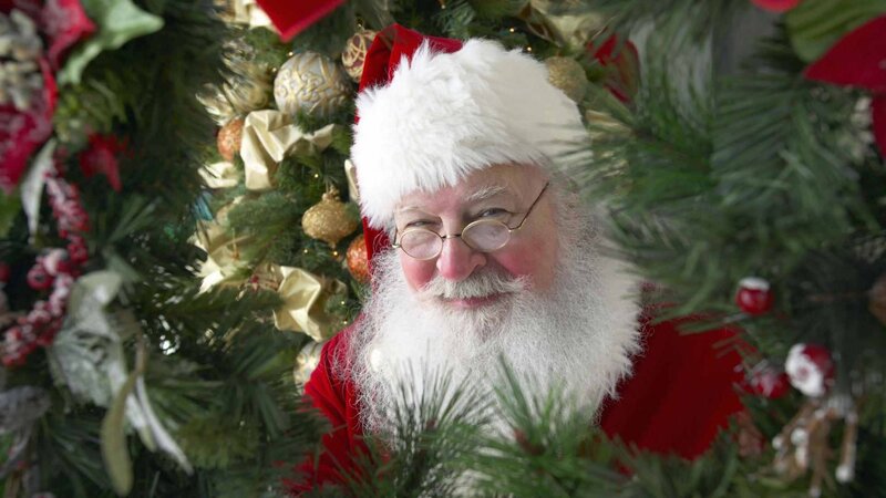 Santa Claus Behind Tree