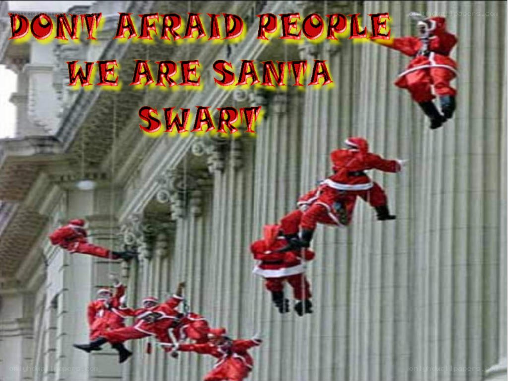 Santa Claus climbing building