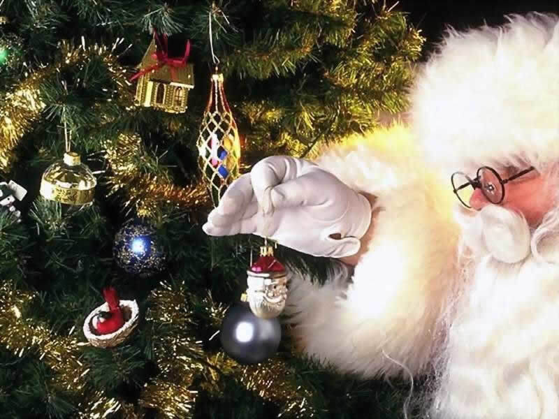 Santa Claus Decorating Tree